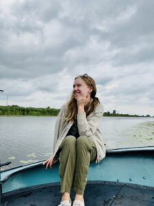 Kayla on a boat while traveling