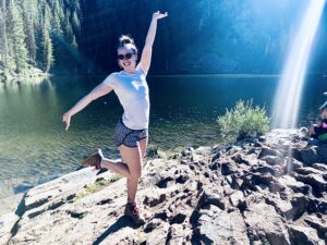 Kayla posing at a lake